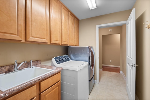 336 Faith Dr, Gibsonville, NC 27249 - laundry room with washer and dryer, light tile patterned floors, and cabinet space