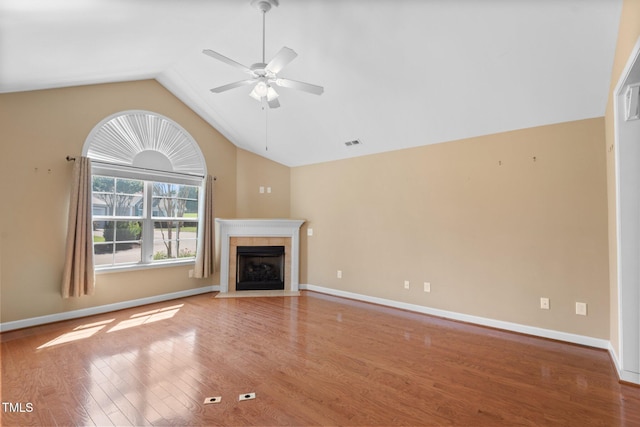 336 Faith Dr, Gibsonville, NC 27249 - unfurnished living room with lofted ceiling, a ceiling fan, wood finished floors, and a fireplace