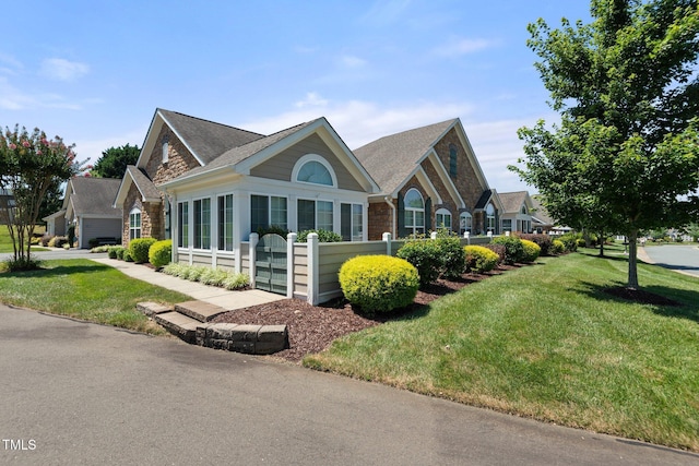 336 Faith Dr, Gibsonville, NC 27249 - view of front facade with a shingled roof and stone siding