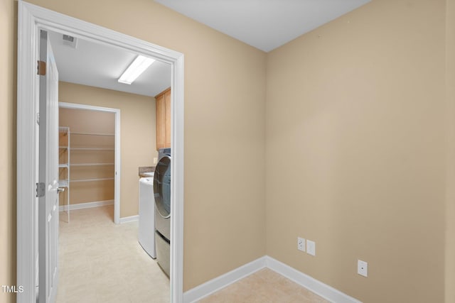 336 Faith Dr, Gibsonville, NC 27249 - laundry area with cabinet space and baseboards