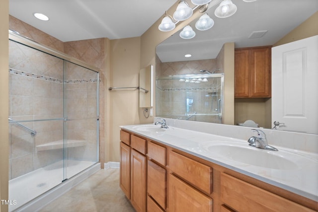 336 Faith Dr, Gibsonville, NC 27249 - bathroom featuring a shower stall, double vanity, and tile patterned floors