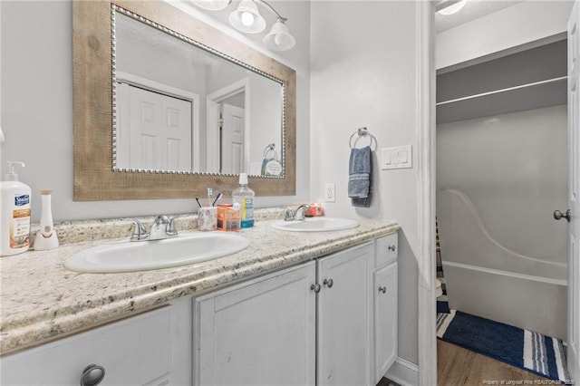 3374 Legion Rd, Hope Mills, NC 28348 - bathroom featuring double vanity and wood finished floors