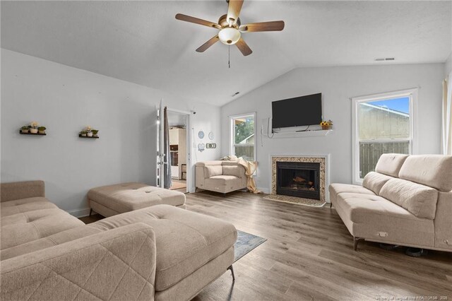 3374 Legion Rd, Hope Mills, NC 28348 - living room with ceiling fan, vaulted ceiling, wood finished floors, and a high end fireplace