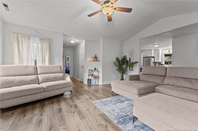 3374 Legion Rd, Hope Mills, NC 28348 - living room featuring ceiling fan, light wood-type flooring, healthy amount of natural light, and lofted ceiling