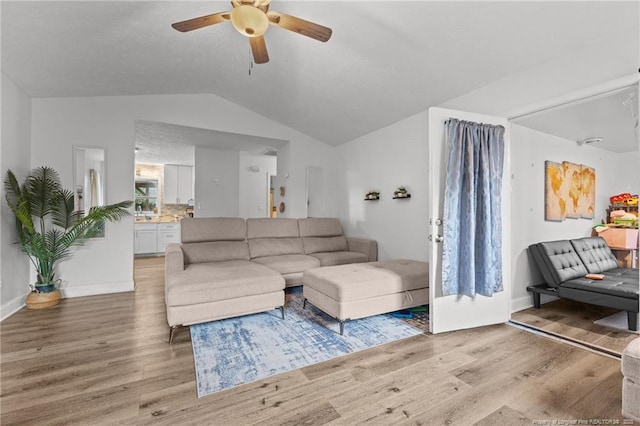 3374 Legion Rd, Hope Mills, NC 28348 - living area featuring light wood-style flooring, a ceiling fan, and lofted ceiling