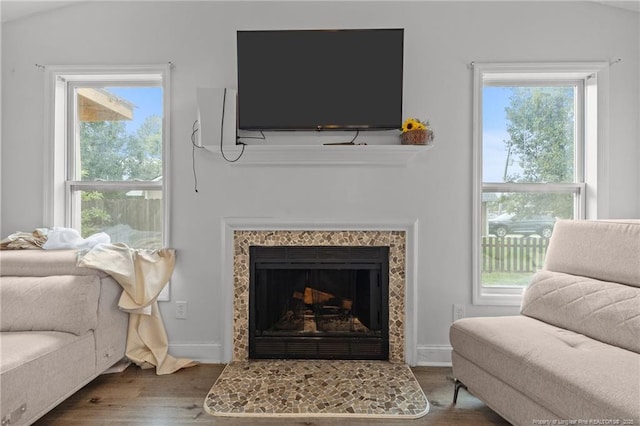 3374 Legion Rd, Hope Mills, NC 28348 - living area with wood finished floors, healthy amount of natural light, and a tile fireplace