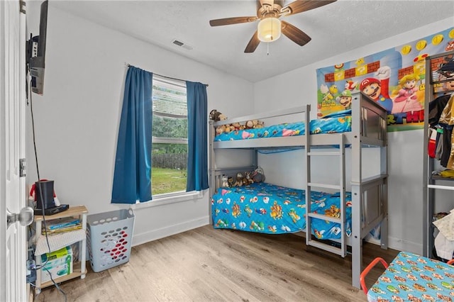 3374 Legion Rd, Hope Mills, NC 28348 - bedroom featuring wood finished floors and a ceiling fan