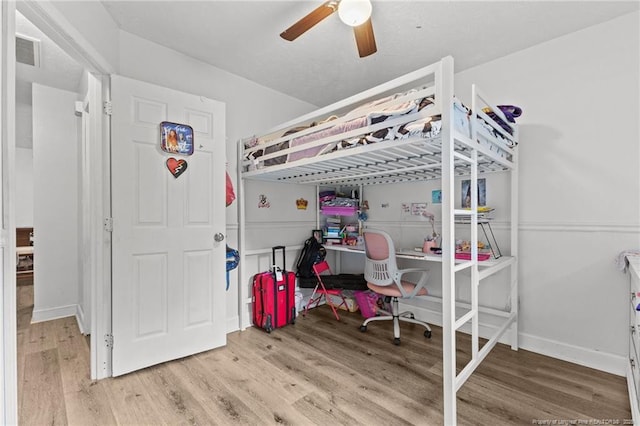3374 Legion Rd, Hope Mills, NC 28348 - bedroom featuring wood finished floors and a ceiling fan