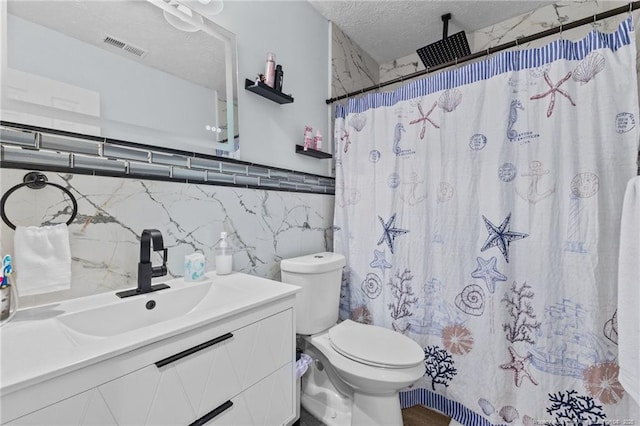 3374 Legion Rd, Hope Mills, NC 28348 - bathroom featuring tile walls, vanity, a shower with curtain, and a textured ceiling