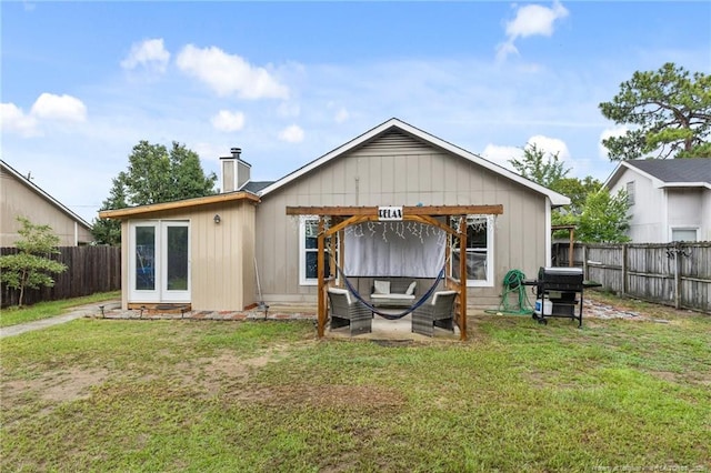 3374 Legion Rd, Hope Mills, NC 28348 - back of house featuring a fenced backyard and a chimney