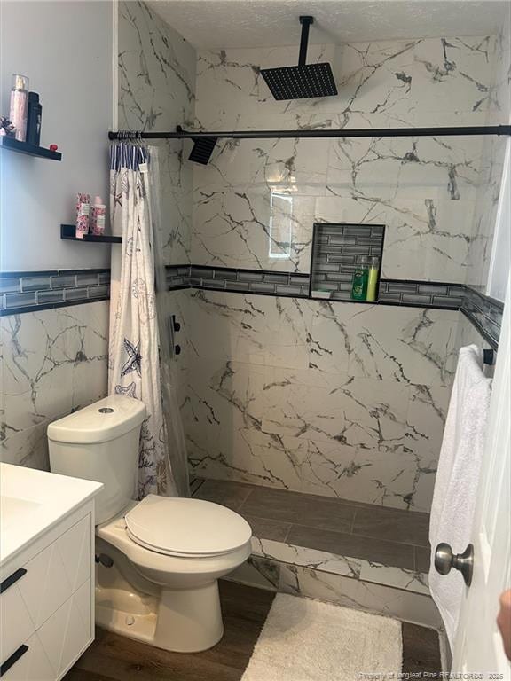 3374 Legion Rd, Hope Mills, NC 28348 - full bathroom featuring tile walls, vanity, a marble finish shower, and wood finished floors
