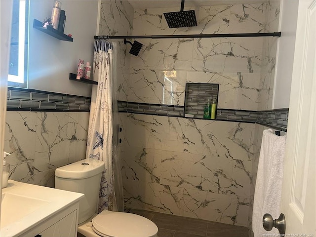 3374 Legion Rd, Hope Mills, NC 28348 - bathroom featuring tile walls, a marble finish shower, and vanity