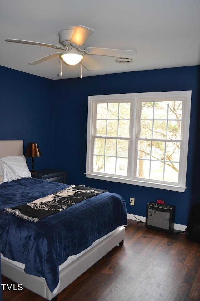 138 Dorsey Pl, Henderson, NC 27536 - bedroom featuring multiple windows, hardwood / wood-style floors, and a ceiling fan