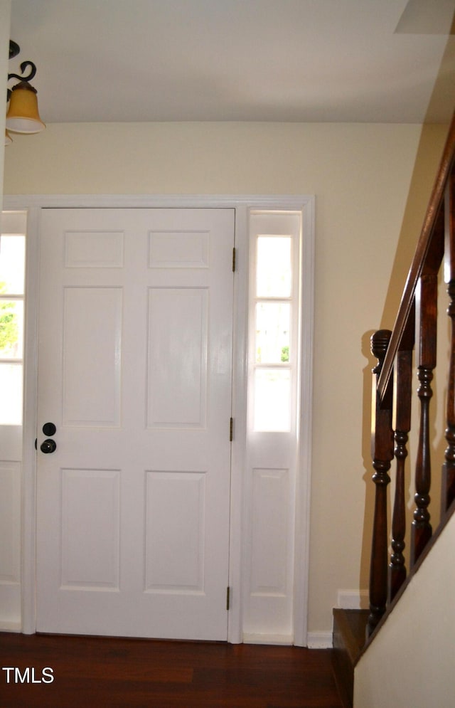 138 Dorsey Pl, Henderson, NC 27536 - foyer with stairs and dark wood finished floors