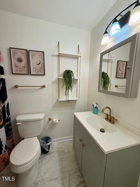 138 Dorsey Pl, Henderson, NC 27536 - bathroom with marble look tile flooring and vanity
