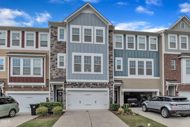 2849 Dallas Valley Ln, Apex, NC 27502 - townhome / multi-family property featuring board and batten siding, stone siding, a garage, and driveway