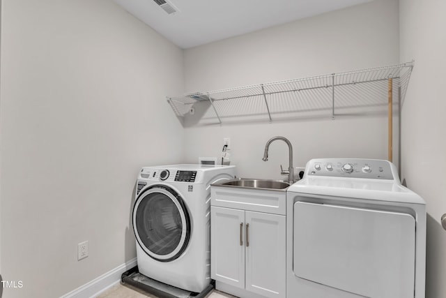 2849 Dallas Valley Ln, Apex, NC 27502 - laundry room featuring washer and clothes dryer and cabinet space