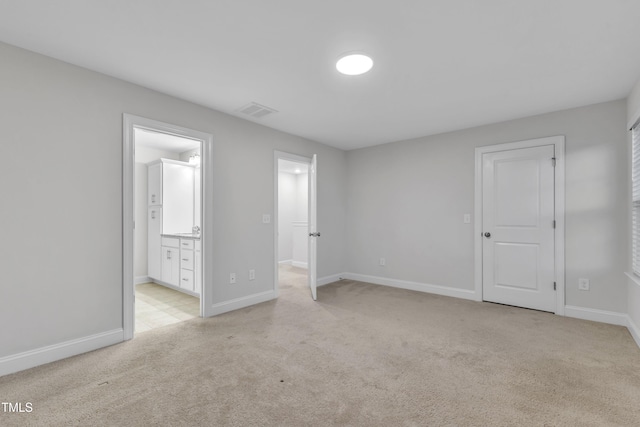 2849 Dallas Valley Ln, Apex, NC 27502 - unfurnished bedroom with light carpet and connected bathroom