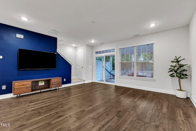 2849 Dallas Valley Ln, Apex, NC 27502 - unfurnished living room with wood finished floors and recessed lighting