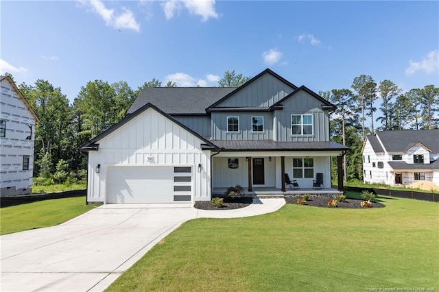 412 Stable Ct, Linden, NC 28356 - modern farmhouse with board and batten siding, a porch, a garage, and a front yard