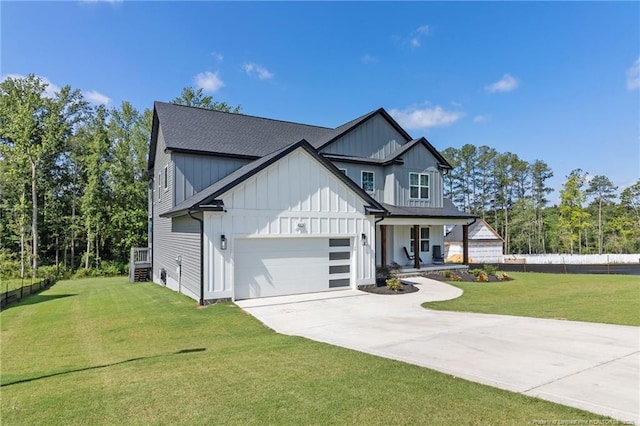 412 Stable Ct, Linden, NC 28356 - modern inspired farmhouse with board and batten siding, driveway, a garage, covered porch, and a shingled roof