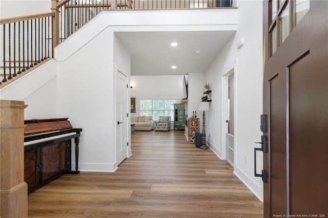 412 Stable Ct, Linden, NC 28356 - entryway featuring wood finished floors, stairs, recessed lighting, and a high ceiling