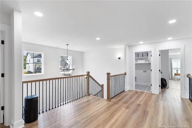 412 Stable Ct, Linden, NC 28356 - corridor featuring a chandelier, light wood-style floors, recessed lighting, and an upstairs landing