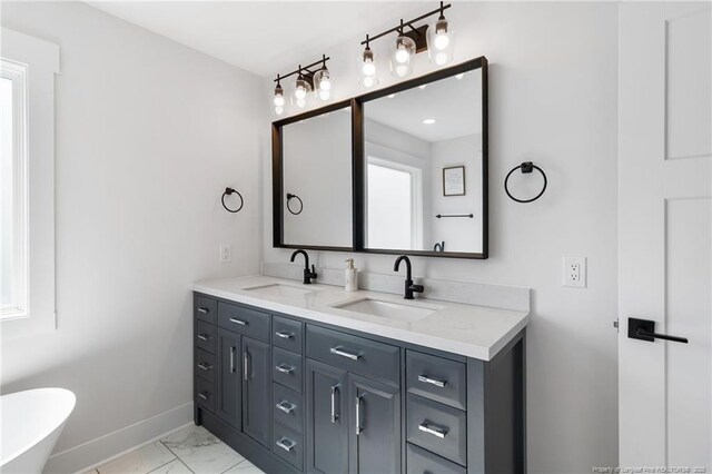 412 Stable Ct, Linden, NC 28356 - full bath with marble finish flooring, double vanity, and a freestanding tub