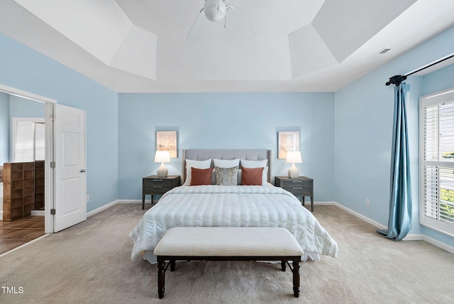 308 Minton Valley Ln, Cary, NC 27519 - bedroom with light colored carpet, a tray ceiling, and multiple windows