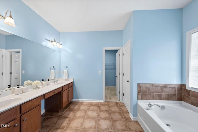 308 Minton Valley Ln, Cary, NC 27519 - bathroom featuring double vanity, a bath, a spacious closet, and tile patterned floors