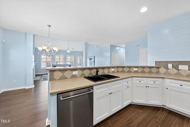 308 Minton Valley Ln, Cary, NC 27519 - kitchen featuring stainless steel dishwasher, dark wood-type flooring, a peninsula, a chandelier, and backsplash