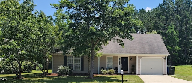 10 N Berrymeadow Ln, Durham, NC 27703 - view of front of house featuring an attached garage, driveway, a front lawn, and covered porch
