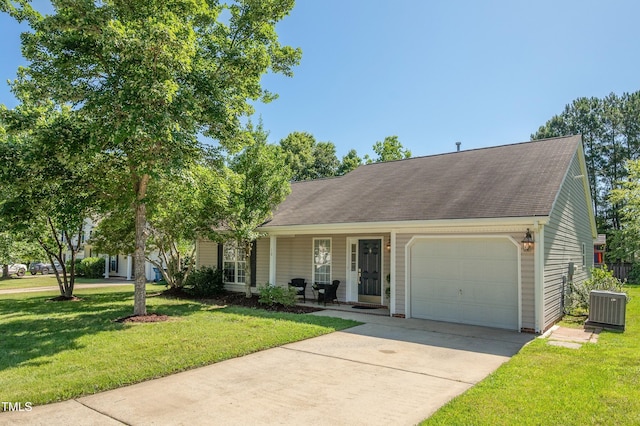 10 N Berrymeadow Ln, Durham, NC 27703 - view of front of house featuring an attached garage, concrete driveway, a front yard, and covered porch