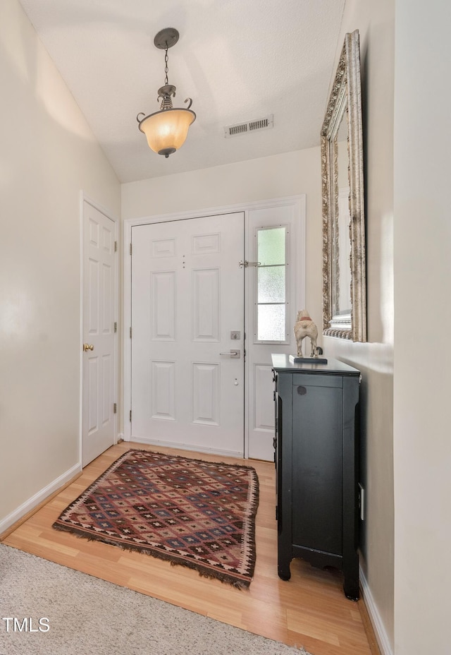 10 N Berrymeadow Ln, Durham, NC 27703 - entryway featuring light wood-style floors and baseboards
