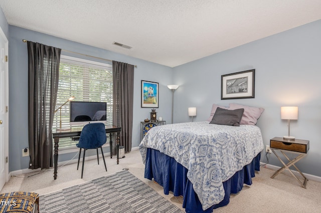 10 N Berrymeadow Ln, Durham, NC 27703 - bedroom featuring light colored carpet and a textured ceiling