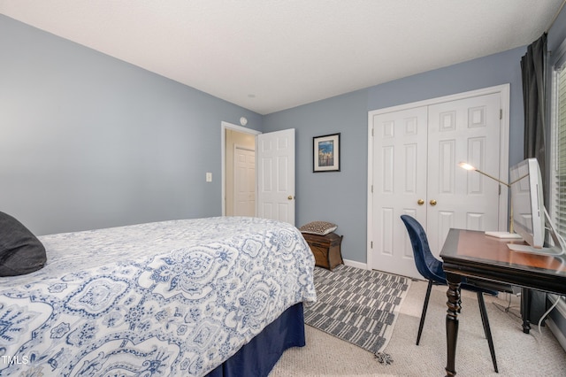 10 N Berrymeadow Ln, Durham, NC 27703 - carpeted bedroom with a closet and baseboards