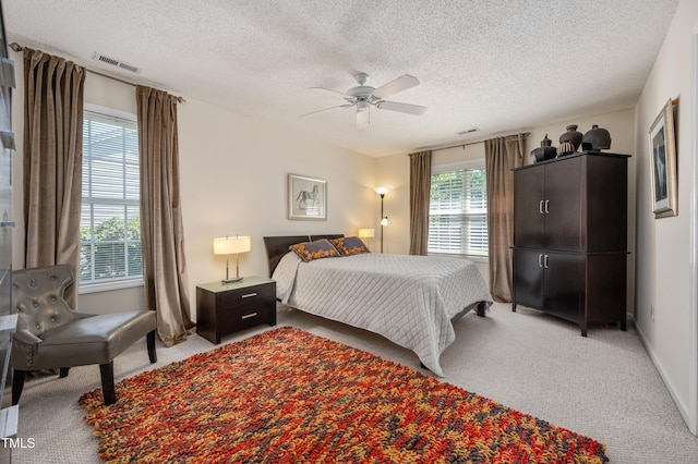 10 N Berrymeadow Ln, Durham, NC 27703 - bedroom with light carpet, a textured ceiling, and ceiling fan