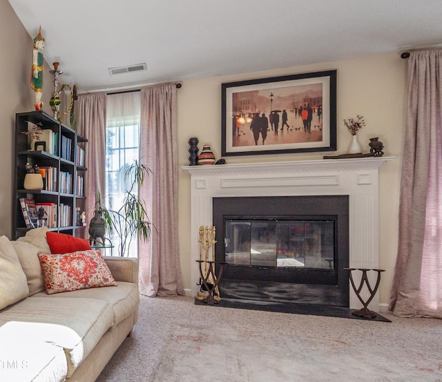 10 N Berrymeadow Ln, Durham, NC 27703 - carpeted living area with a fireplace with flush hearth and baseboards