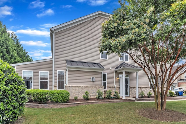 2801 Casona Way, Raleigh, NC 27616 - view of front of property featuring brick siding, a standing seam roof, a front lawn, and a metal roof
