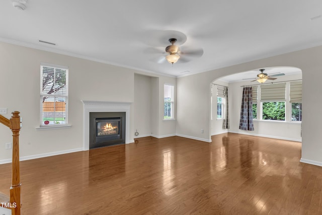 2801 Casona Way, Raleigh, NC 27616 - unfurnished living room featuring a ceiling fan, plenty of natural light, crown molding, and wood finished floors