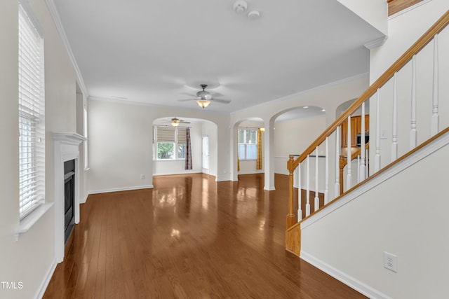 2801 Casona Way, Raleigh, NC 27616 - entrance foyer with stairway, a ceiling fan, arched walkways, ornamental molding, and wood finished floors