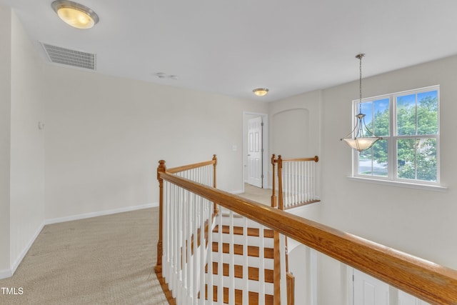2801 Casona Way, Raleigh, NC 27616 - hallway with an upstairs landing and light colored carpet
