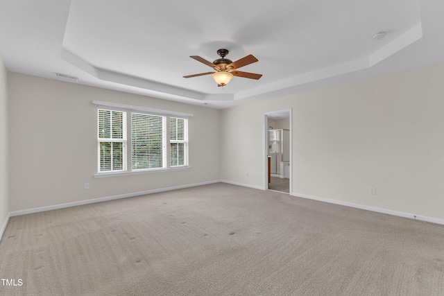 2801 Casona Way, Raleigh, NC 27616 - carpeted empty room with a raised ceiling, a smoke detector, and a ceiling fan