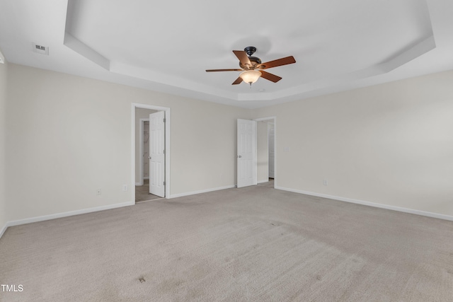 2801 Casona Way, Raleigh, NC 27616 - carpeted empty room featuring a tray ceiling and ceiling fan