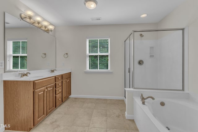 2801 Casona Way, Raleigh, NC 27616 - full bath featuring plenty of natural light, a garden tub, double vanity, and a shower stall