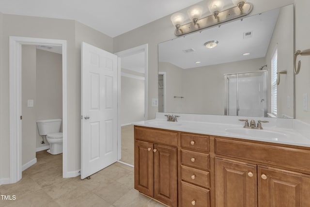 2801 Casona Way, Raleigh, NC 27616 - bathroom with double vanity, a shower stall, and tile patterned flooring