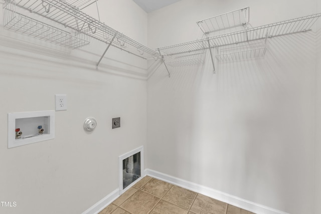 2801 Casona Way, Raleigh, NC 27616 - washroom with hookup for an electric dryer, hookup for a gas dryer, washer hookup, and light tile patterned floors