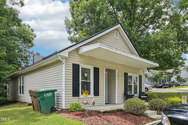 307 Wax Myrtle Ct, Cary, NC 27513 - view of front of property with a chimney and a porch