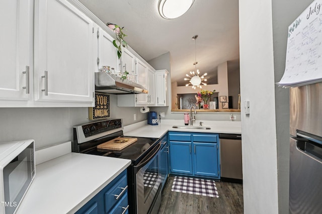 307 Wax Myrtle Ct, Cary, NC 27513 - kitchen featuring appliances with stainless steel finishes, blue cabinets, under cabinet range hood, dark wood-style floors, and white cabinetry
