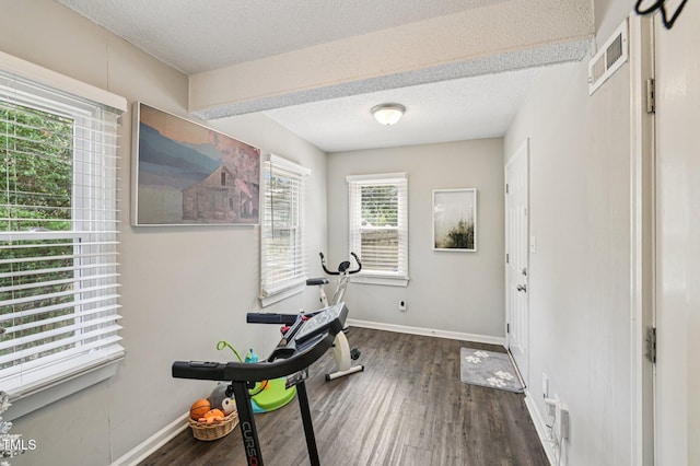 307 Wax Myrtle Ct, Cary, NC 27513 - exercise room with a textured ceiling and wood finished floors